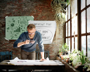 hipster guy at window